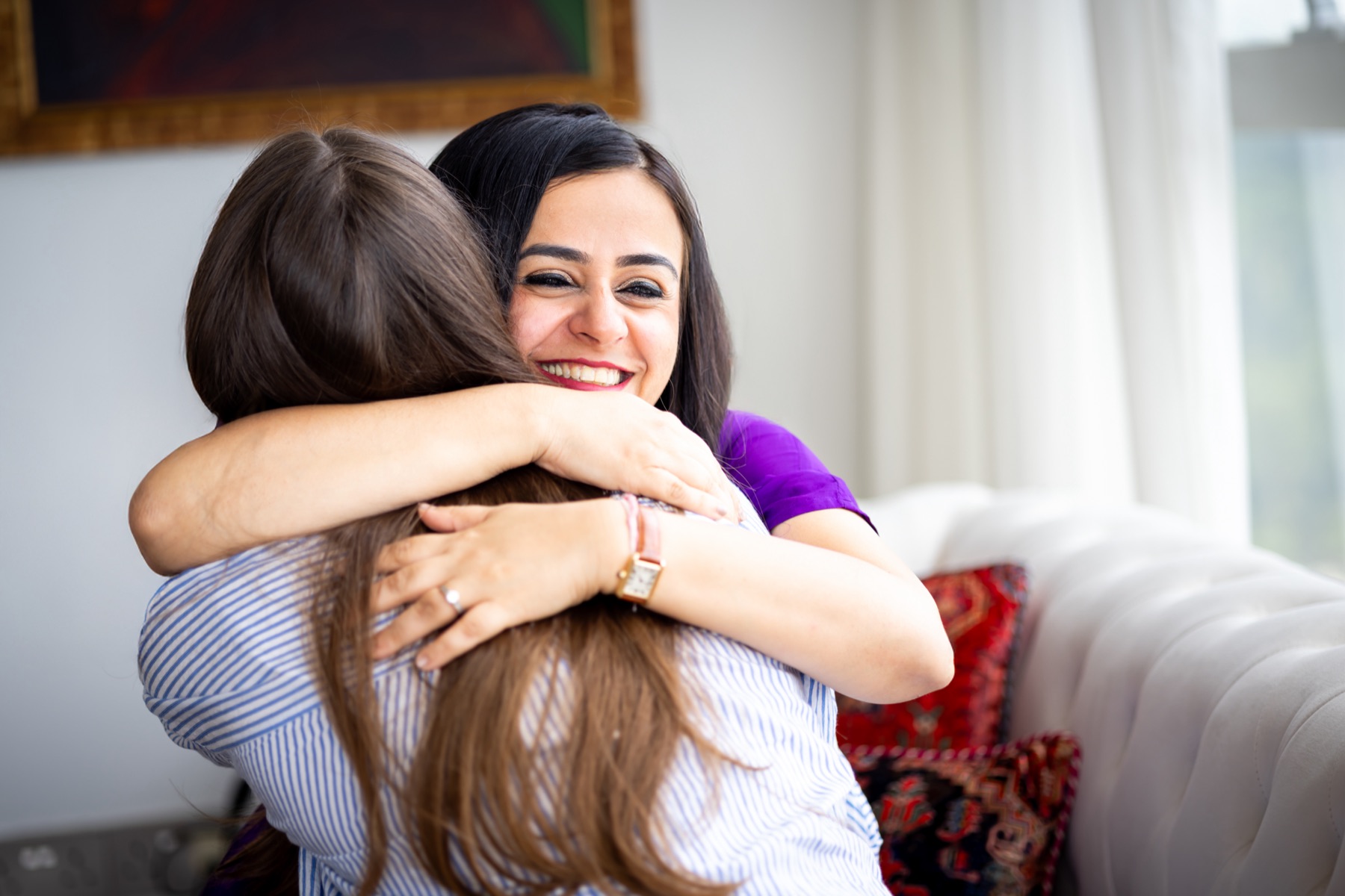 Ritika embracing a client