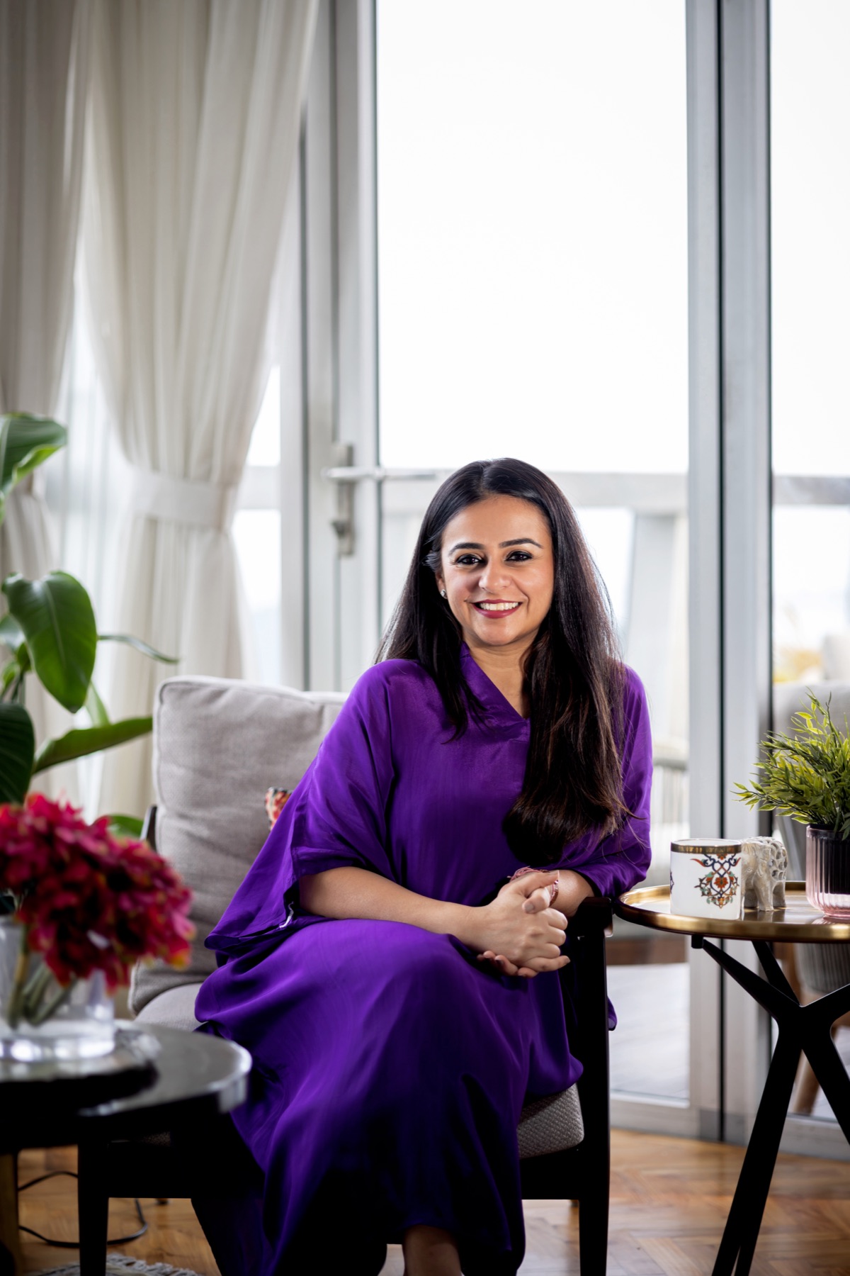 Ritika seated in a sunlit room