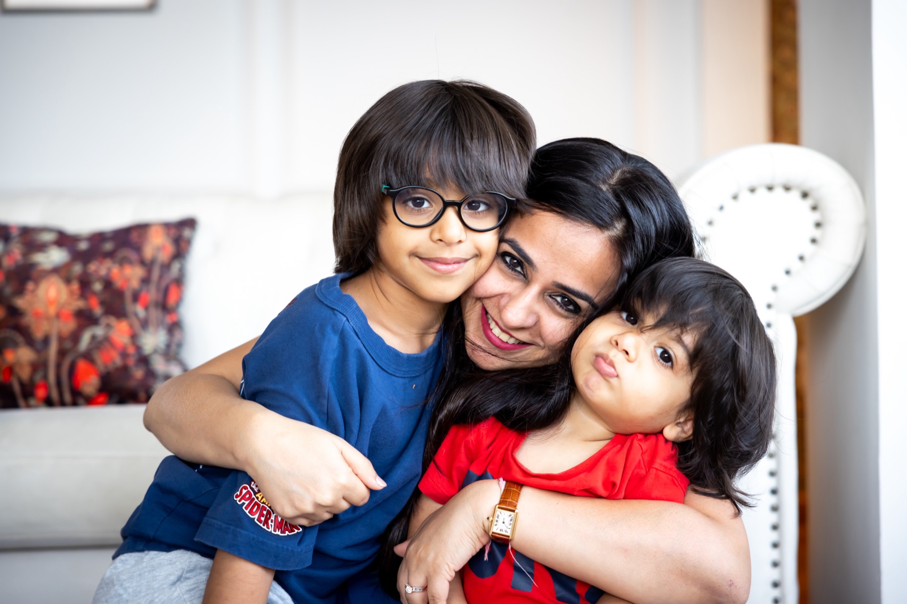 Ritika hugging her two sons
